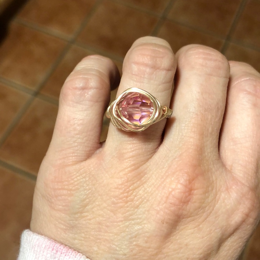 Beautiful gold wire ring with dazzling pink bead